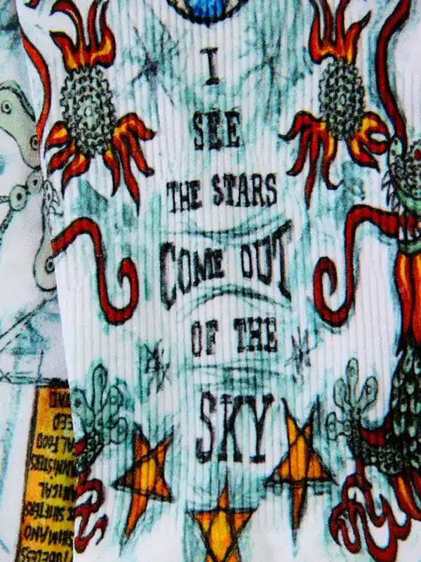 Cycling jersey with 'I see the stars come out of the sky' graphic, flame and star designs on white fabric