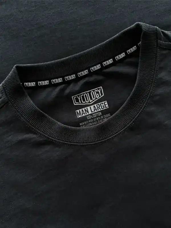 Black men's cycling t-shirt with Cycology brand label, size large, 100% cotton, ribbed neckline detail