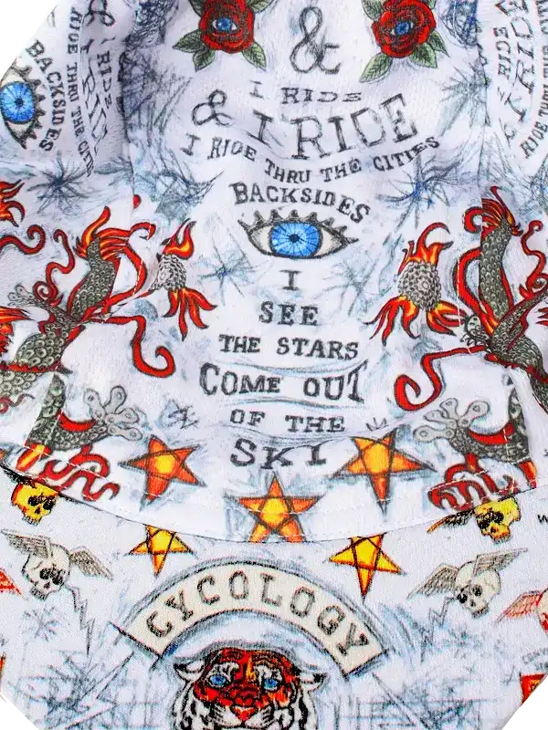 Men's cycling jersey with bold tattoo-style graphics, stars, dragons, and 'I Ride' text on white fabric