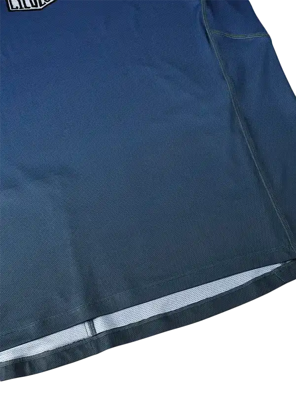Blue cycling jersey with reflective hem and breathable fabric for men's and women's rides