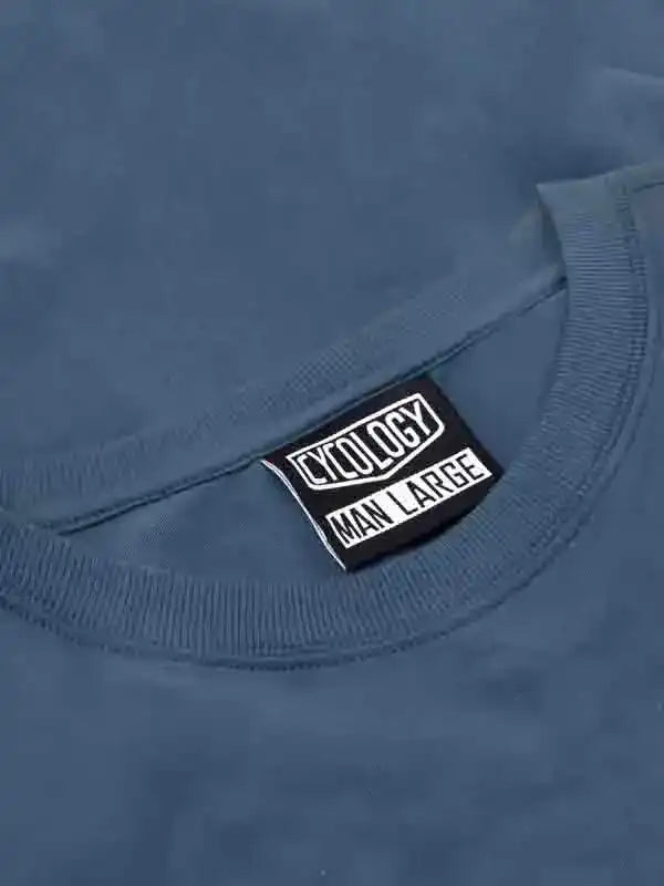 Cycology men's large cycling t-shirt tag on blue fabric