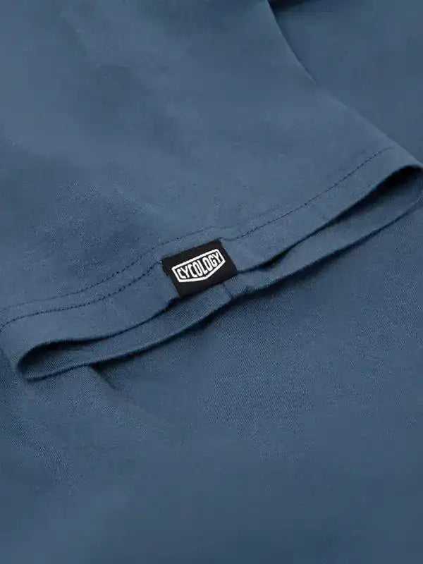 Cycology branded tag on blue cycling apparel fabric