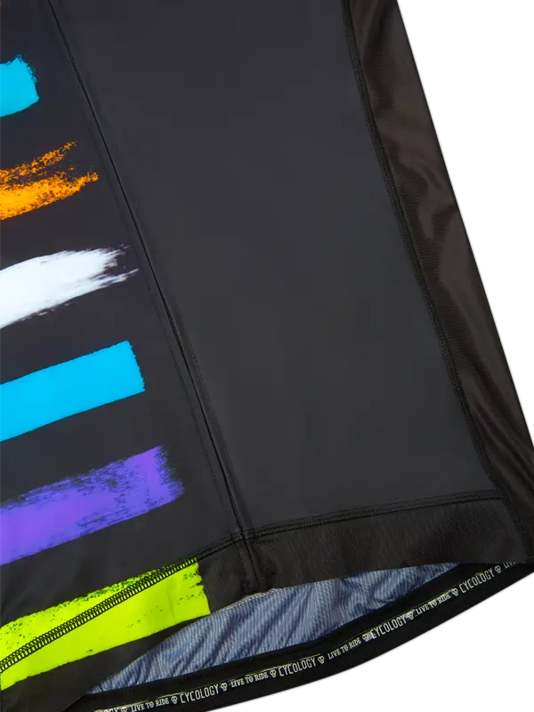 Close-up of a black jersey with colorful abstract patterns on a white background