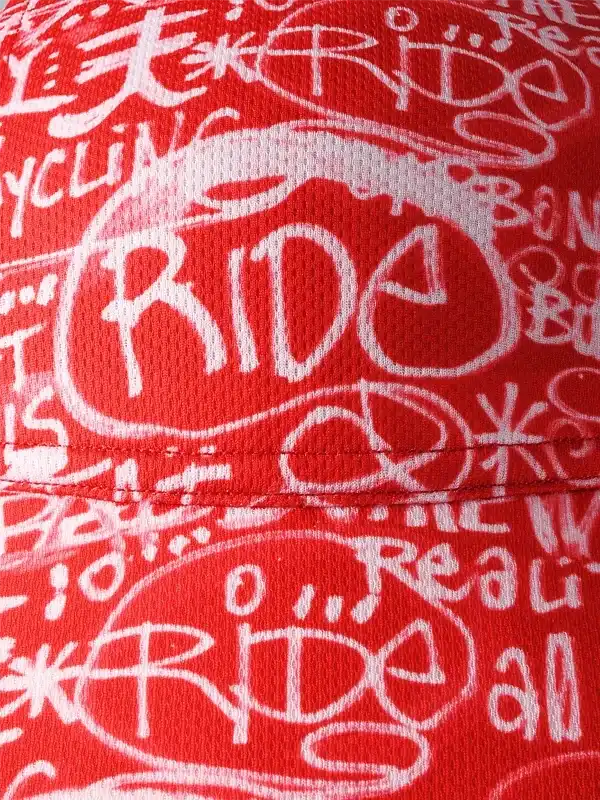 Red cycling jersey with bold white 'RIDE' graffiti print, breathable fabric for men's and women's bike wear