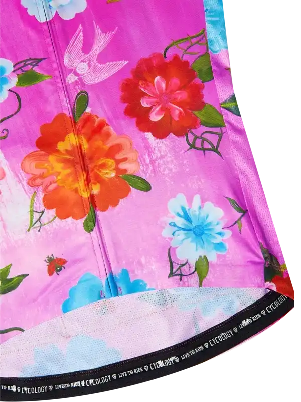 Vibrant floral cycling jersey with pink base, red and blue flowers, birds, and 'CYCOLOGY' waistband