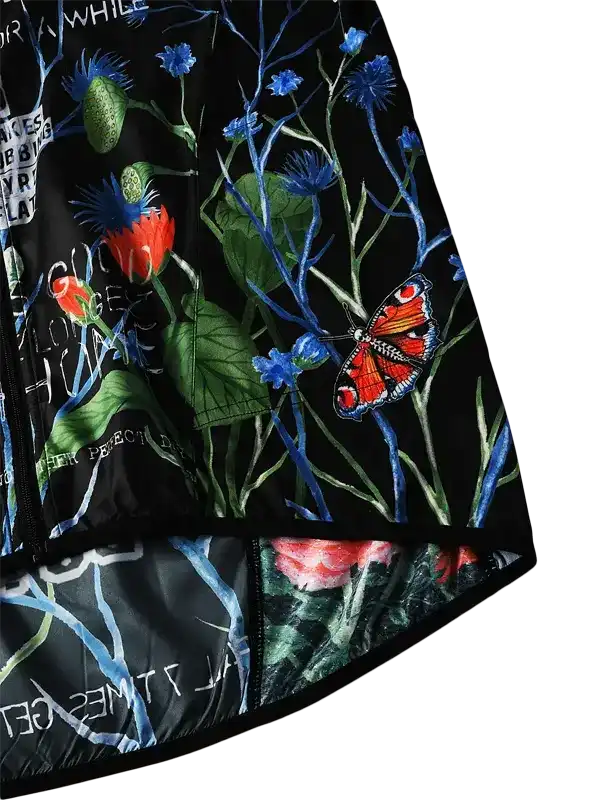 Women's cycling jersey with vibrant floral and butterfly print on black fabric, stylish active wear