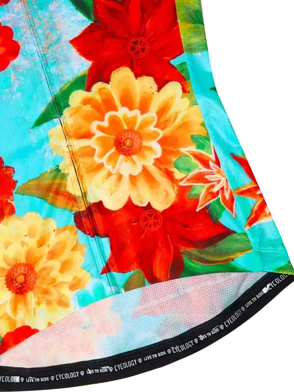 Vibrant floral cycling jersey with red and yellow blooms on turquoise background, ideal for women's rides.