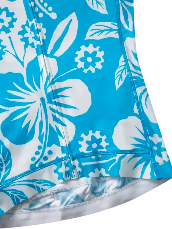 Blue and white floral pattern cycling shorts with gear accents, breathable fabric detail