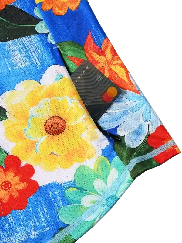 Vibrant floral cycling jersey with yellow, orange, and blue blooms on breathable fabric