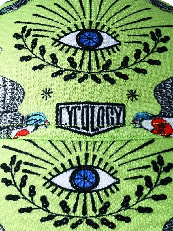 Vibrant green cycling cap with eye and bird print, featuring bold graphic design for cyclists.