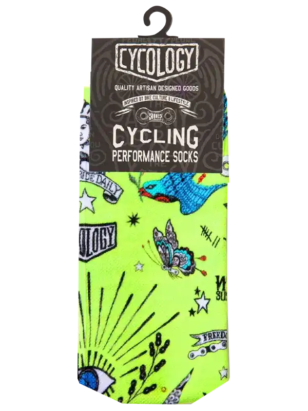 Cycling performance socks with vibrant neon green tattoo-style print, featuring birds, butterflies, and stars for bike riders.