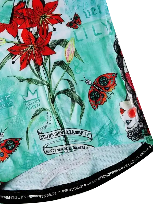 Women's cycling jersey with red lilies, butterflies, and 'Cycling Queen' print on mint green fabric