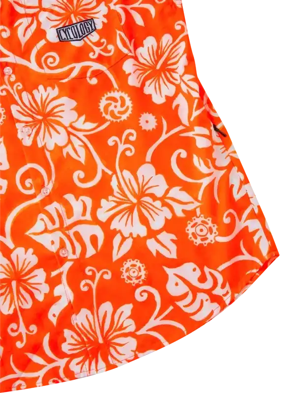 Vibrant orange cycling shirt with white hibiscus floral print and brand patch, ideal for summer rides.