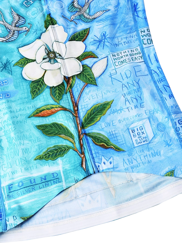 Textile with floral design and text overlay on a blue background