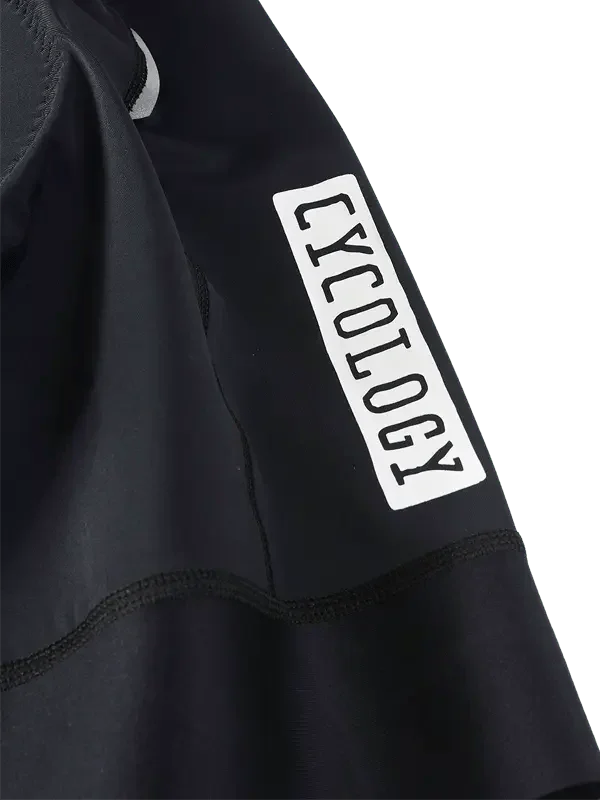 Black cycling jersey sleeve with white CYCOLOGY logo, high-quality fabric detail