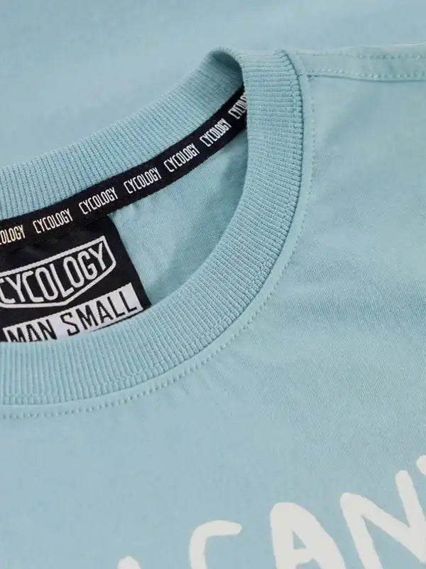 Light blue men's cycling t-shirt with branded neck tape and tag, size small