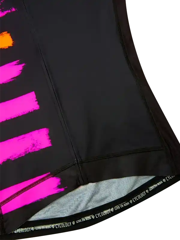 Black cycling jersey with vibrant pink and orange brushstroke design, featuring 'CYCOLOGY LIVE TO RIDE' hem detail