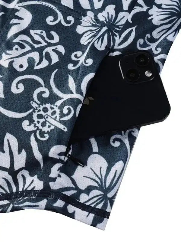 Men's cycling jersey with floral pattern and rear pocket holding smartphone