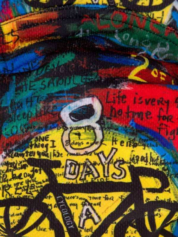 Vibrant cycling jersey with '8 DAYS A WEEK' graphic, graffiti-style text, and bold colors for road biking
