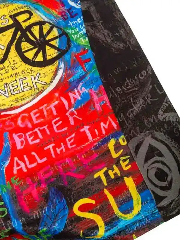 Colorful cycling jersey with bold graffiti-style art, bike graphic, and motivational text for men's and women's rides