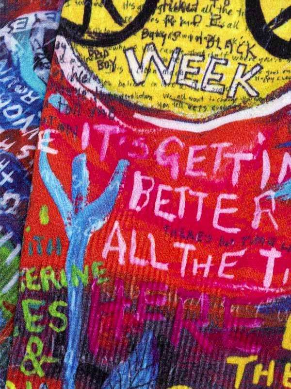 Colorful cycling jersey with bold graphic text and vibrant graffiti-style design for men and women.