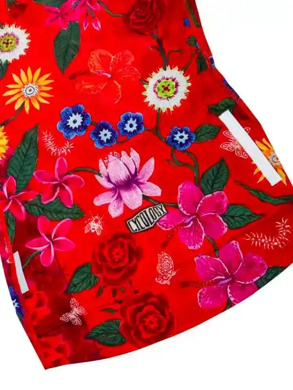Vibrant red cycling jersey with floral print, featuring pink, blue, and yellow flowers, green leaves, and butterfly details.