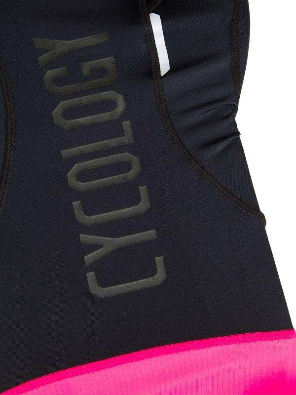 Black cycling jersey with bold 'CYCOLOGY' text and vibrant pink hem, showcasing performance fabric design.