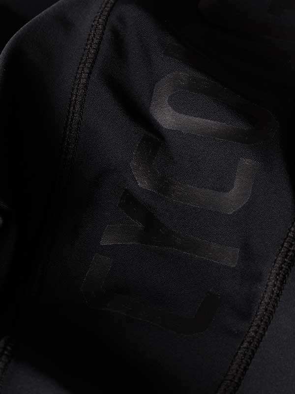 Black cycling jersey with subtle logo, high-quality fabric detail for men's and women's rides