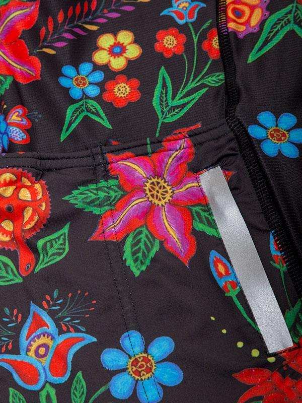 Vibrant floral pattern cycling jersey with reflective strip, colorful flowers on black fabric