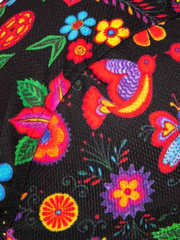 Vibrant floral and bird print on black cycling jersey fabric, colorful design for women's or men's bike wear