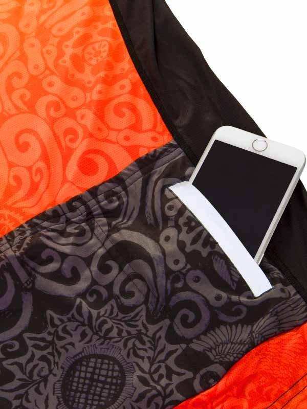 Cycling jersey pocket holding smartphone, orange and black patterned design for men's or women's bike wear