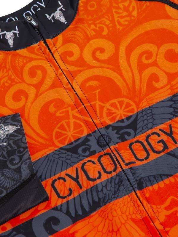 Orange and black cycling jersey with bold swirl patterns, bike graphics, and CYCOLOGY branding