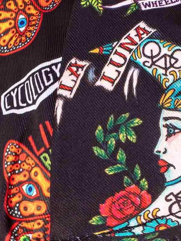 Vibrant tattoo-style cycling jersey with Luna design, roses, and butterfly motifs on black fabric