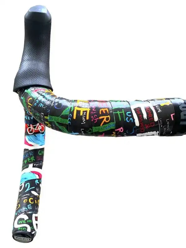 Colorful graffiti-style cycling handlebar tape with bold lettering and bike icons for road bikes