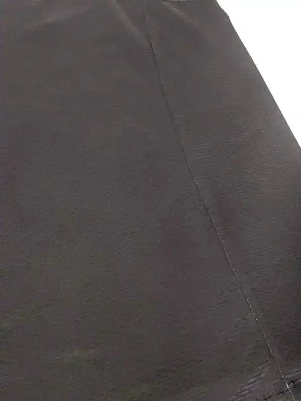 Close-up of dark cycling shorts fabric with flatlock seams for comfort and durability