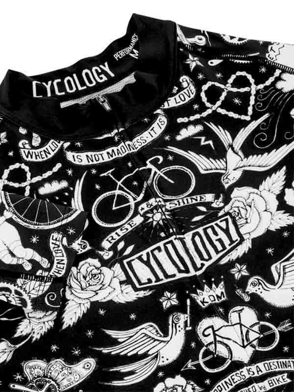 Black cycling jersey with white tattoo-style graphics, birds, roses, and 'Cycology' branding