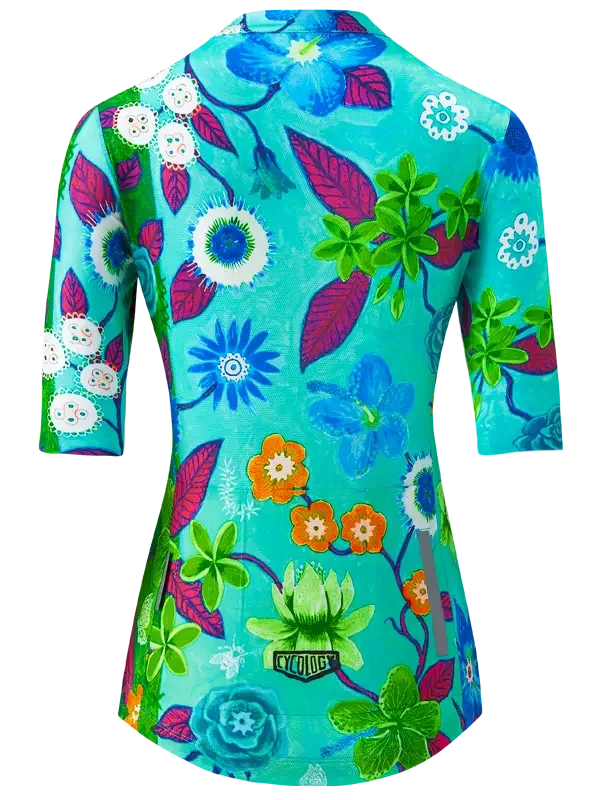 Women's cycling jersey with vibrant floral print in blue, green, and orange, featuring 3/4 sleeves and reflective details.