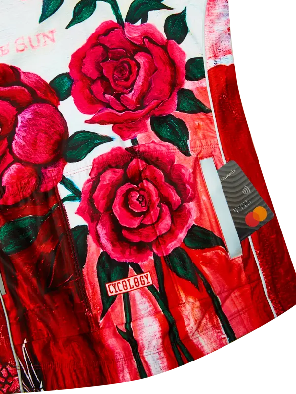 Red cycling jersey  with pink roses and 'Cycology' branding on a white background