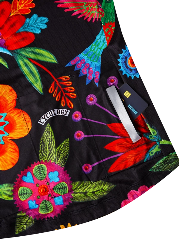 Colorful floral embroidery pattern  on a black background with a brand tag.