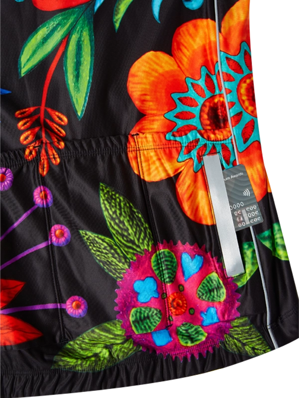 Colorful floral-patterned long sleeve cycling jersey on a black background