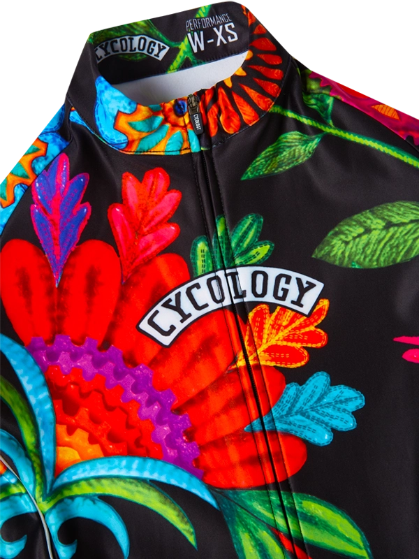 Colorful cycling jersey with Cycology branding on a black background