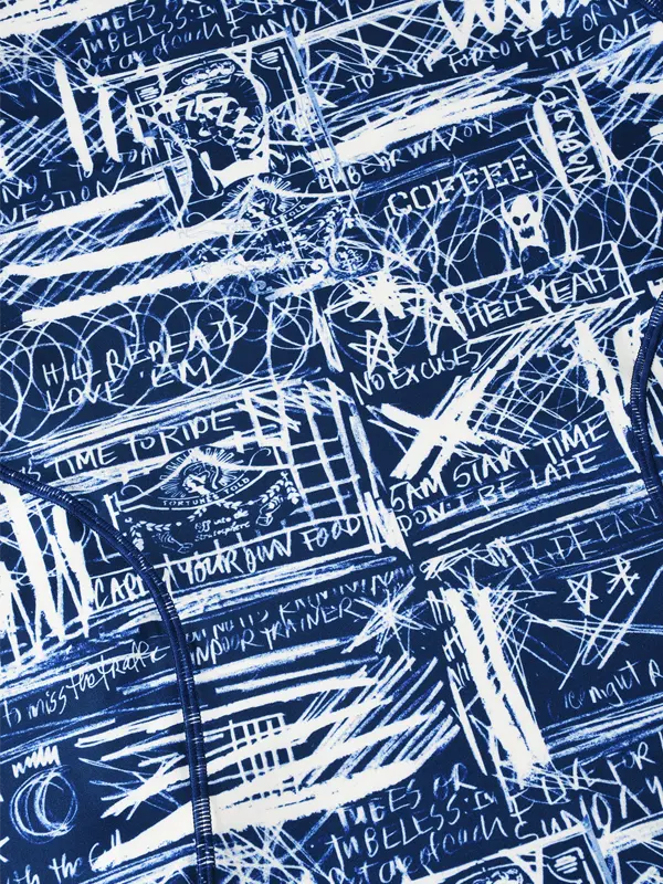 Blue fabric with white text and patterns