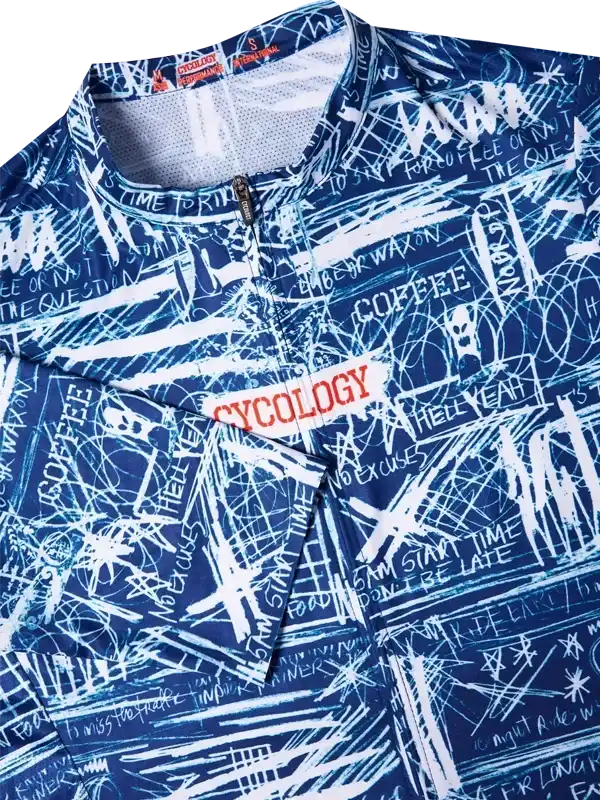 Blue cycling jersey with white graffiti-style print and 'Cycology' logo, featuring motivational phrases and zippered front.