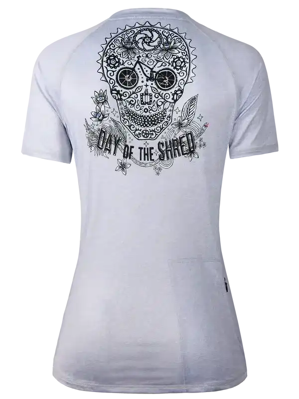 Women's cycling jersey with sugar skull 'Day of the Shred' graphic, floral and bike wheel details