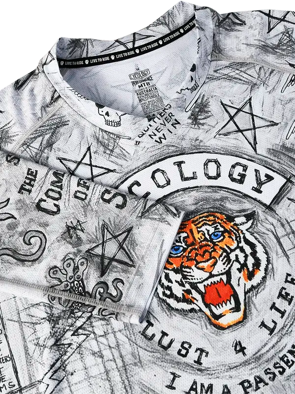 Close-up of a  MTB Jersey  with graphic city of Angels designs and text, including a tiger and star symbols.
