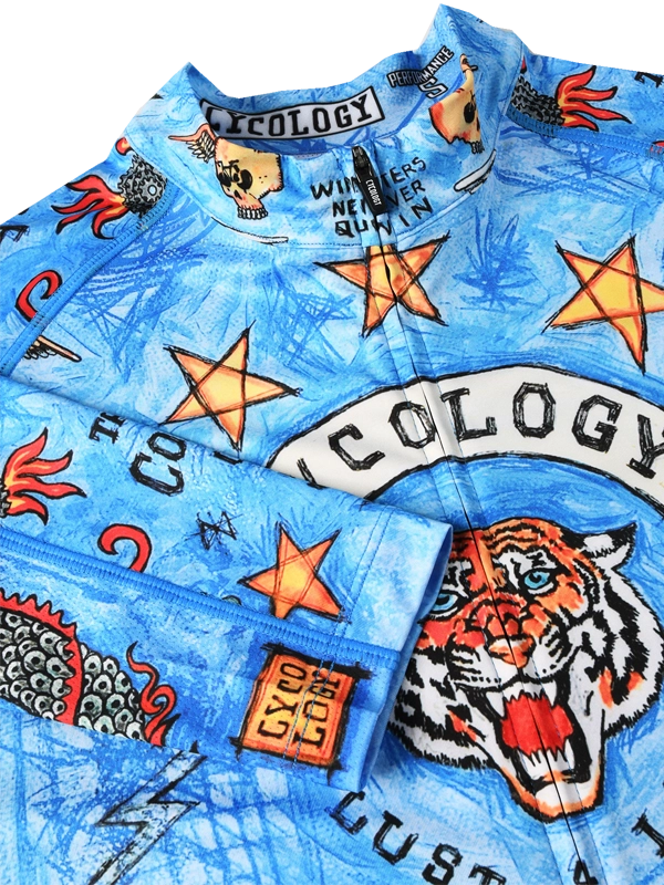 Blue cycling jersey with tattoo-style graphics and 'Cycology' branding