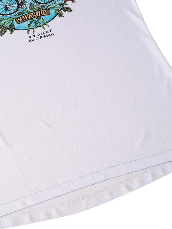 Close-up of a white garment with a brand logo and text on a white background