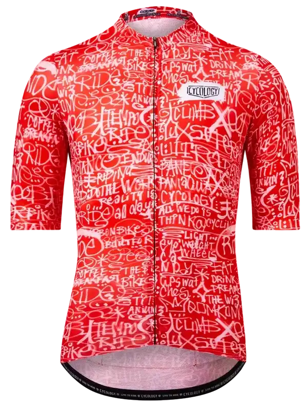 Red women's cycling jersey with white graffiti-style text, featuring 'RIDE' and 'CLIMB' designs for road biking.