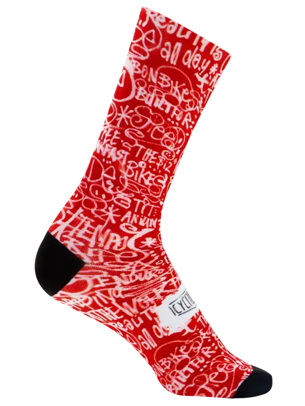 Red cycling sock with white graffiti-style text, black toe and heel, ideal for bike rides and athletic wear.