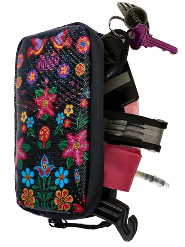 Floral-patterned bike frame bag with keys and tools, ideal for cycling storage